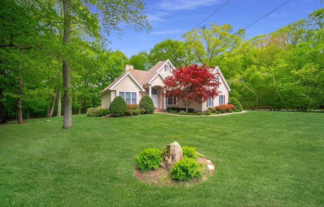 42 N Woods Rd, Hamden, CT 06518 - view of front facade featuring a chimney and a front lawn