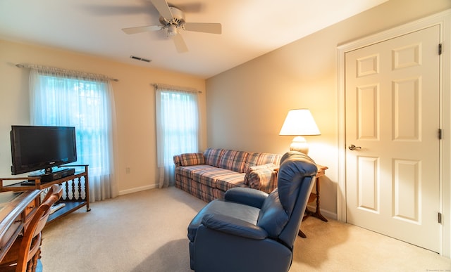 42 N Woods Rd, Hamden, CT 06518 - living room with light colored carpet, ceiling fan, and baseboards