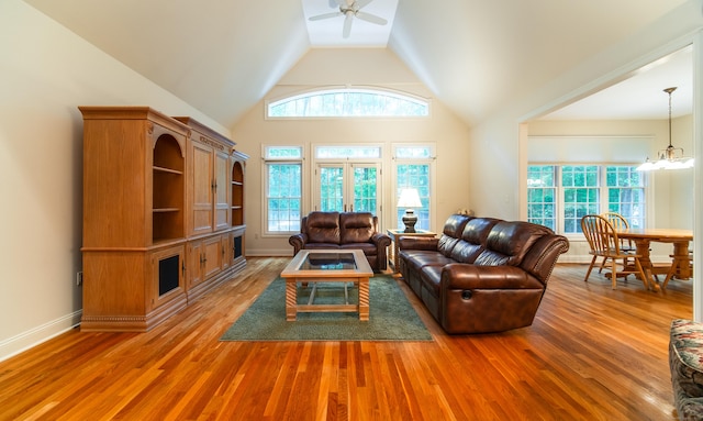42 N Woods Rd, Hamden, CT 06518 - living room with ceiling fan, light wood-style floors, lofted ceiling, a chandelier, and baseboards