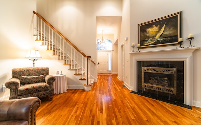 42 N Woods Rd, Hamden, CT 06518 - living room with a high ceiling, wood finished floors, stairs, and baseboards