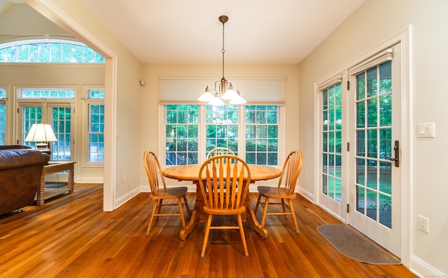 42 N Woods Rd, Hamden, CT 06518 - dining room with wood finished floors, baseboards, and a chandelier
