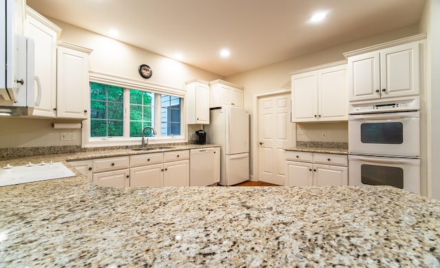 42 N Woods Rd, Hamden, CT 06518 - kitchen featuring white appliances, a sink, light stone countertops, and recessed lighting