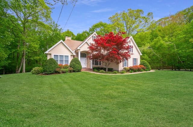 42 N Woods Rd, Hamden, CT 06518 - view of property hidden behind natural elements with a front lawn and a chimney