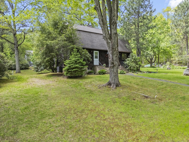 63 Schofield Rd Apt 60, Willington, CT 06279 - view of front of house featuring roof with shingles and a front yard