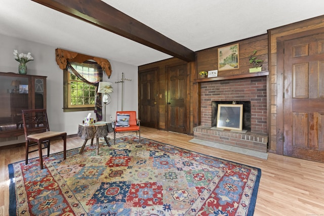 63 Schofield Rd Apt 60, Willington, CT 06279 - living area with wood finished floors, a fireplace, and beam ceiling