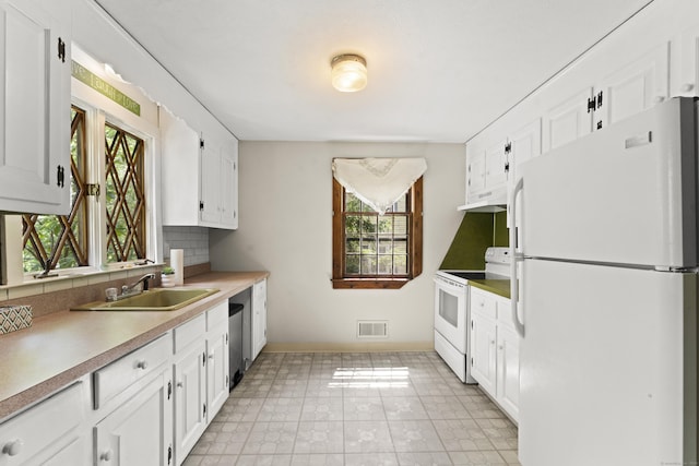 63 Schofield Rd Apt 60, Willington, CT 06279 - kitchen with white appliances, white cabinets, backsplash, a sink, and under cabinet range hood