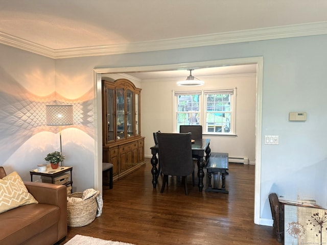 dining room with dark wood-style flooring, crown molding, baseboards, and a baseboard heating unit