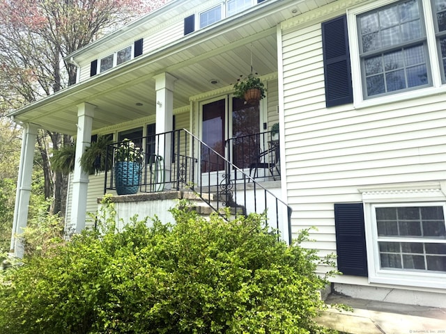 doorway to property featuring covered porch