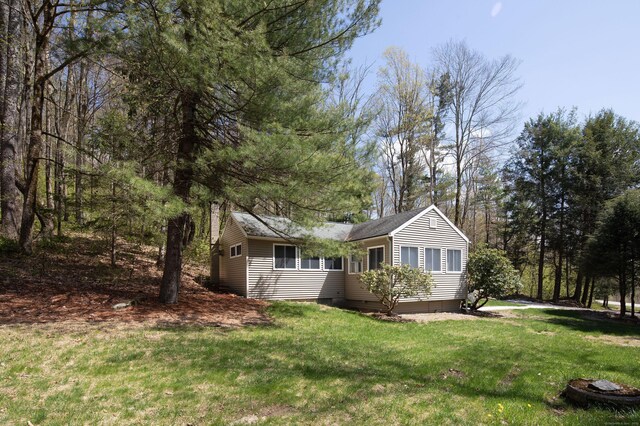 174 Bunker Hill Rd, Cornwall, CT 06796 - view of front of property featuring a front lawn and roof with shingles