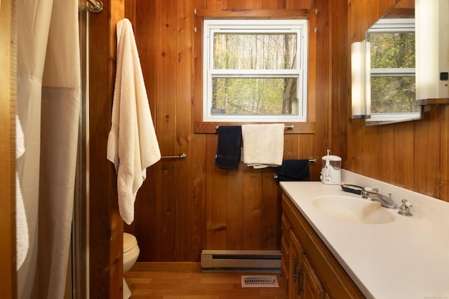 174 Bunker Hill Rd, Cornwall, CT 06796 - full bathroom with a baseboard heating unit, vanity, toilet, wood walls, and wood finished floors