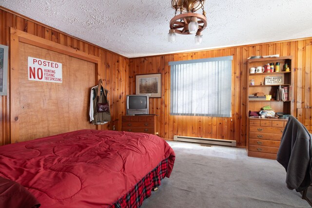 174 Bunker Hill Rd, Cornwall, CT 06796 - bedroom with a baseboard radiator, wood walls, carpet, and a textured ceiling
