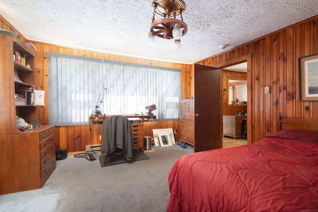 174 Bunker Hill Rd, Cornwall, CT 06796 - bedroom with wooden walls, carpet floors, a baseboard radiator, and a textured ceiling