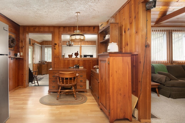 174 Bunker Hill Rd, Cornwall, CT 06796 - dining space featuring wood walls, light wood finished floors, and a textured ceiling