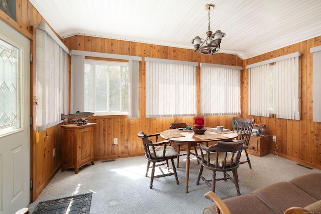 174 Bunker Hill Rd, Cornwall, CT 06796 - dining room with wood walls, a chandelier, vaulted ceiling, baseboards, and carpet flooring