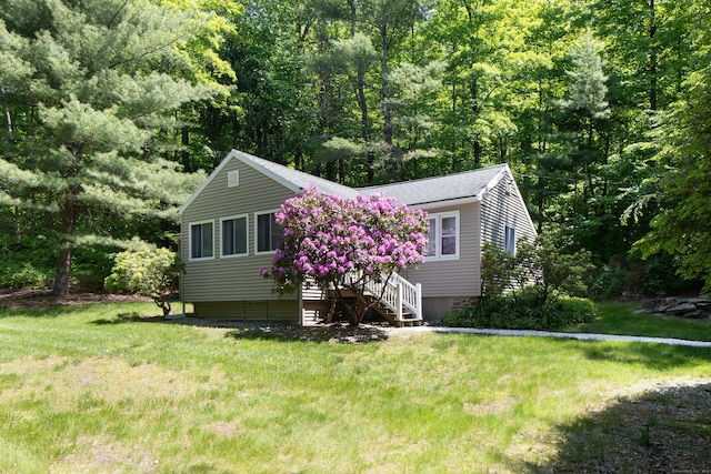 174 Bunker Hill Rd, Cornwall, CT 06796 - view of front facade with a front lawn and roof with shingles