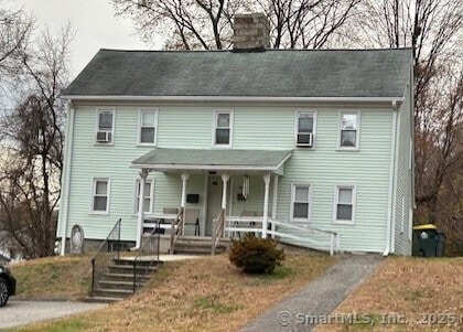 80 Colony St, Ansonia, CT 06401 - view of front facade with covered porch and a chimney