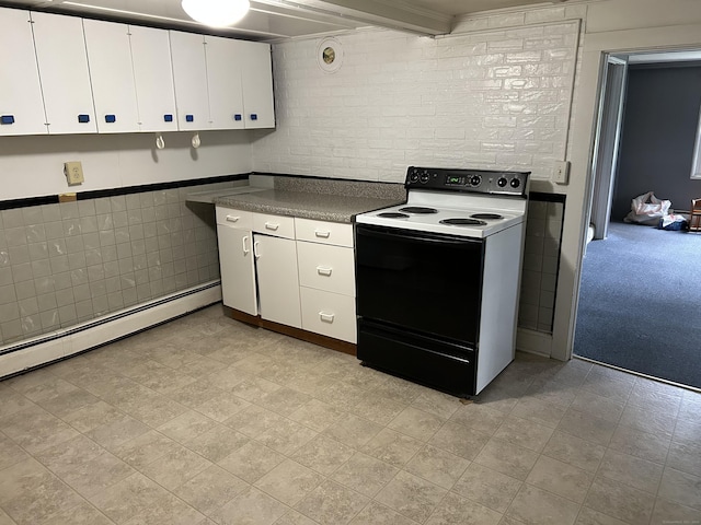 80 Colony St, Ansonia, CT 06401 - kitchen featuring electric range, white cabinets, dark countertops, baseboard heating, and a wainscoted wall