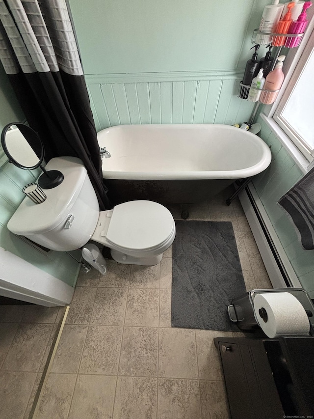 80 Colony St, Ansonia, CT 06401 - full bathroom featuring a freestanding bath, toilet, a wainscoted wall, and baseboard heating