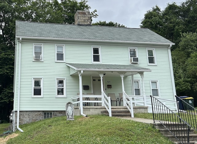 80 Colony St, Ansonia, CT 06401 - view of front of house with a chimney, covered porch, a front yard, and cooling unit