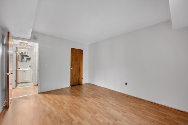 40 Woodsedge Dr Apt 2C, Newington, CT 06111 - unfurnished bedroom with light wood-type flooring, baseboards, and a closet