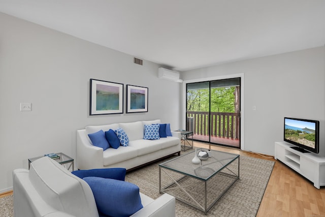 40 Woodsedge Dr Apt 2C, Newington, CT 06111 - living area featuring wood finished floors and an AC wall unit