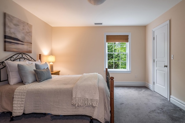 bedroom with carpet and baseboards
