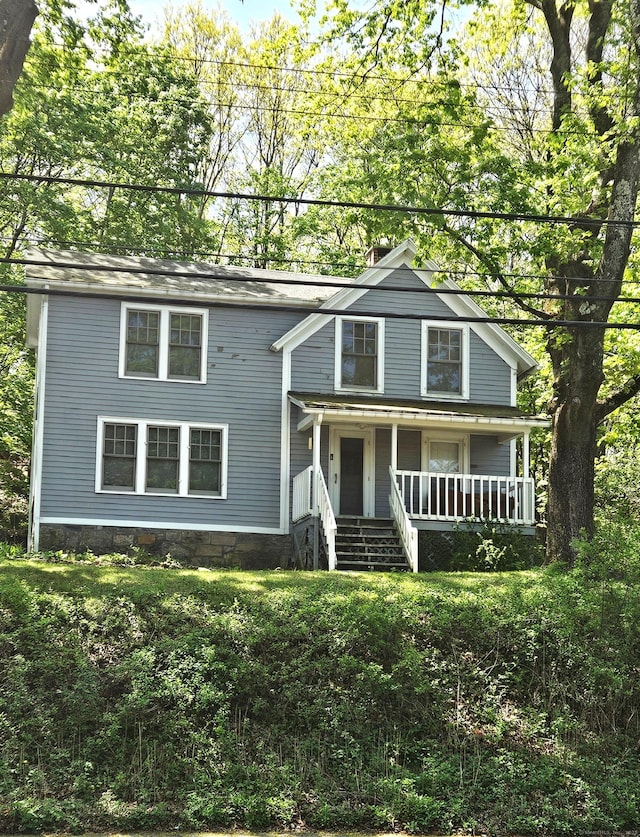 243 Bridge St, Groton, CT 06340 - traditional-style home with a porch
