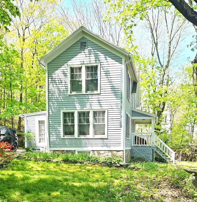 243 Bridge St, Groton, CT 06340 - back of property featuring a yard and stairway