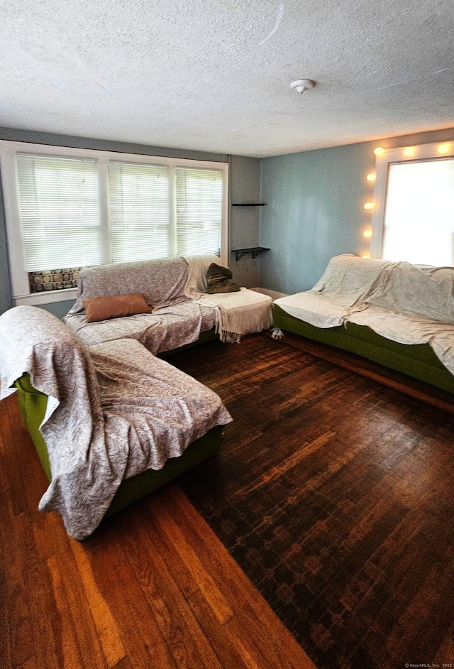 243 Bridge St, Groton, CT 06340 - living area with a textured ceiling and wood finished floors