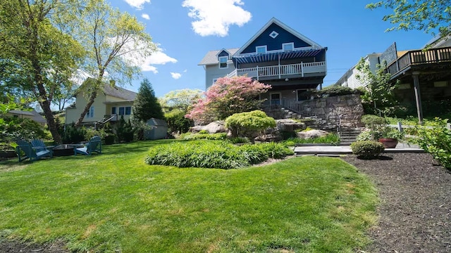 view of yard featuring stairway and a wooden deck