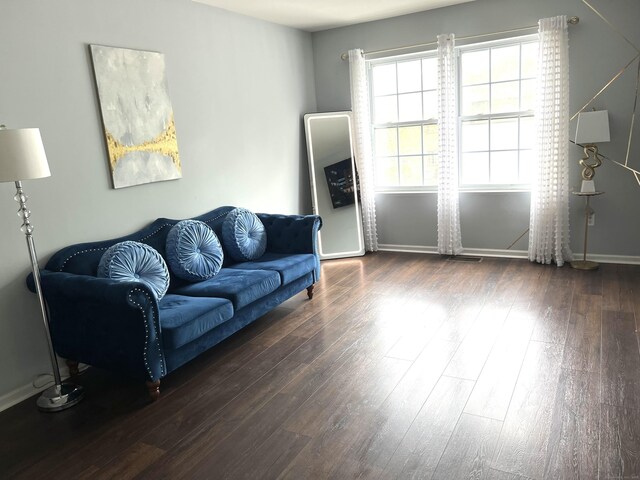 135 Bucks Hill Rd Apt 8, Waterbury, CT 06704 - living area featuring visible vents, baseboards, and hardwood / wood-style flooring