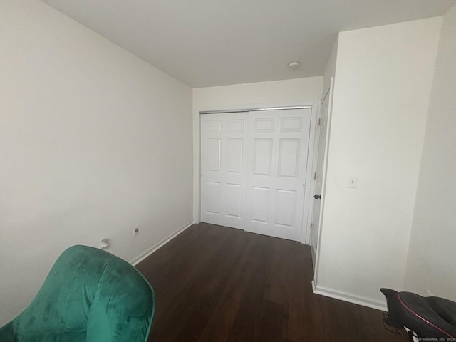 135 Bucks Hill Rd Apt 8, Waterbury, CT 06704 - unfurnished bedroom featuring baseboards and dark wood-style flooring
