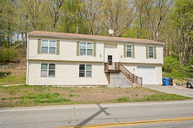 24 Fort Shantok Rd, Montville, CT 06382 - bi-level home with an attached garage and driveway
