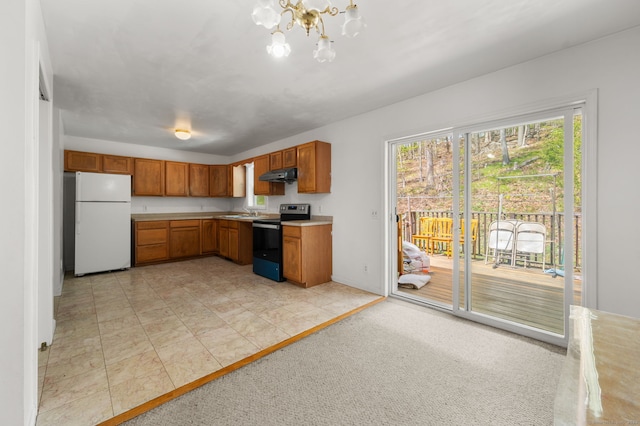 24 Fort Shantok Rd, Montville, CT 06382 - kitchen featuring range with electric stovetop, light countertops, freestanding refrigerator, a notable chandelier, and under cabinet range hood