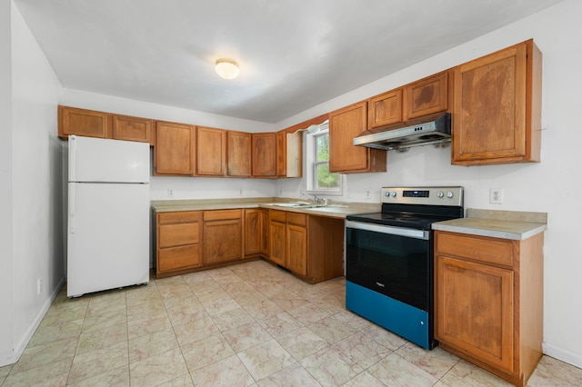 24 Fort Shantok Rd, Montville, CT 06382 - kitchen featuring freestanding refrigerator, stainless steel range with electric stovetop, light countertops, under cabinet range hood, and a sink