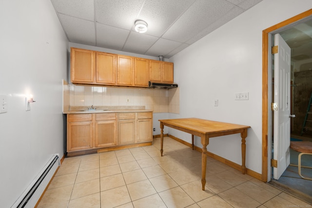 24 Fort Shantok Rd, Montville, CT 06382 - kitchen featuring decorative backsplash, a drop ceiling, baseboard heating, light countertops, and a sink