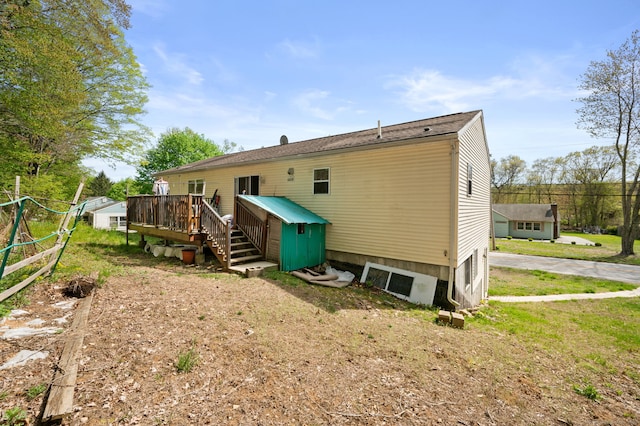 24 Fort Shantok Rd, Montville, CT 06382 - rear view of house with an outbuilding, stairway, a storage shed, and a deck