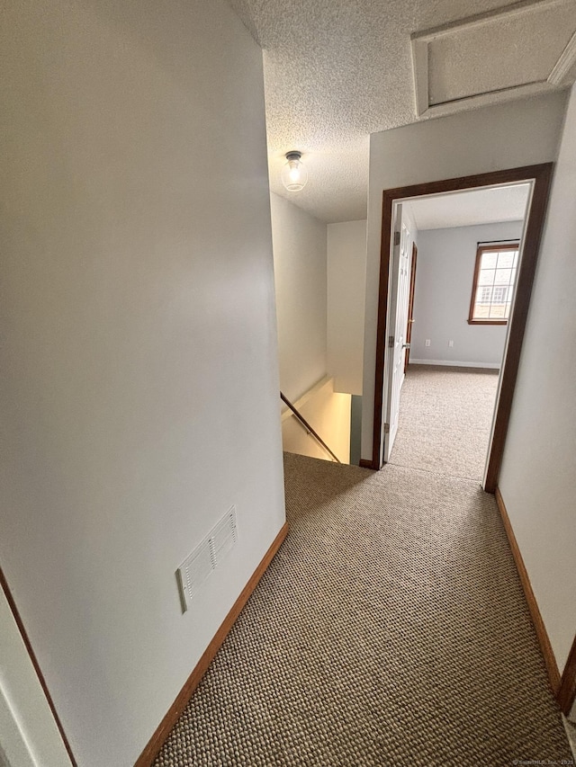 109 Bucks Hill Rd Unit 12, Waterbury, CT 06704 - corridor with carpet, baseboards, attic access, an upstairs landing, and a textured ceiling