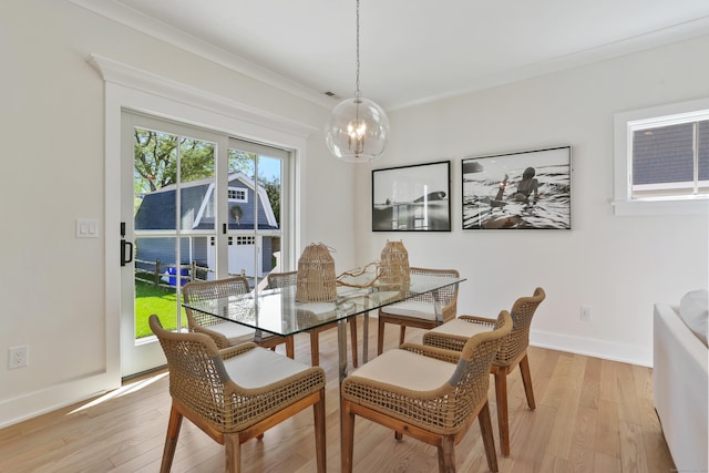 137 Millard St, Fairfield, CT 06824 - dining area with a chandelier, light wood finished floors, and crown molding