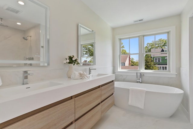 137 Millard St, Fairfield, CT 06824 - full bathroom featuring a freestanding tub, double vanity, and a shower