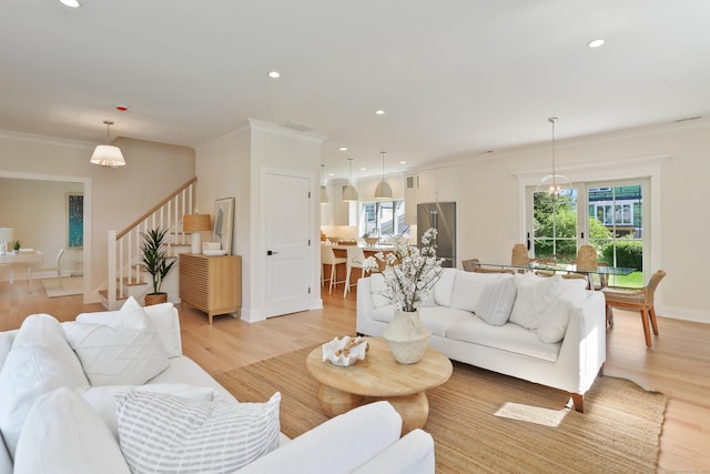 137 Millard St, Fairfield, CT 06824 - living room with stairway, ornamental molding, light wood-type flooring, and recessed lighting