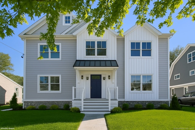 137 Millard St, Fairfield, CT 06824 - view of front of house with a front lawn, a standing seam roof, a metal roof, and board and batten siding