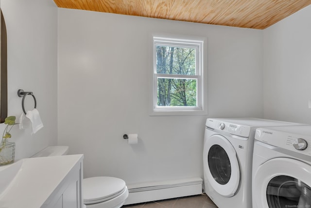laundry area with washer and dryer, laundry area, baseboard heating, tile patterned floors, and wood ceiling