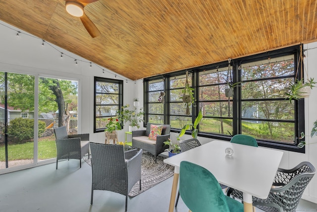sunroom with wood ceiling, ceiling fan, lofted ceiling, and concrete floors