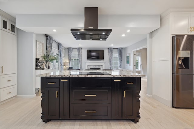 9 Baldwin Dr, Farmington, CT 06032 - kitchen featuring stainless steel fridge with ice dispenser, island exhaust hood, white cabinetry, light wood-style flooring, and recessed lighting