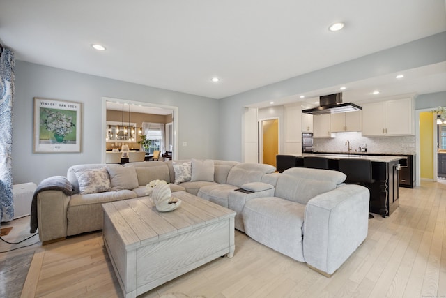 9 Baldwin Dr, Farmington, CT 06032 - living room with light wood-type flooring, recessed lighting, and a chandelier