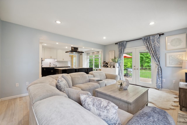 9 Baldwin Dr, Farmington, CT 06032 - living area featuring baseboards, recessed lighting, light wood-style floors, and french doors