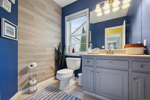 9 Baldwin Dr, Farmington, CT 06032 - bathroom with toilet, vanity, and baseboards