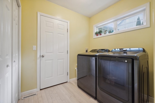 9 Baldwin Dr, Farmington, CT 06032 - laundry room with washer and dryer, light wood-style floors, and baseboards