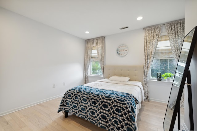 9 Baldwin Dr, Farmington, CT 06032 - bedroom with multiple windows, wood finished floors, baseboards, and recessed lighting